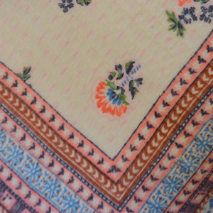 Up close detail of pink flower scarf with blue tassels , Brigitte Flower Scarf. 