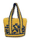 Hand-crocheted rattan tote with blue embroidery, scalloped edges, cotton lining, and wide straps. Lightweight, roomy, and perfect for beach days or travel.