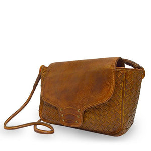 Brown woven leather bag with smooth flap at an angle, Sawyer Woven Shoulder Bag.