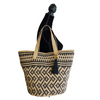 Anabaglish Gigi Woven Tote on a manequin, side view.Natural jute tote with cotton lining, snap closure, and interior zip pocket. Spacious, lightweight, and artisan-made—your everyday carryall with effortless style.