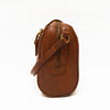 Side view of the bag, handle down, brown leather, Sam Leather Crossbody Bag.