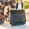 Navy tooled leather bag being used, Annie Tooled Tote.