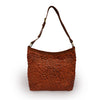 Rust leather shoulder bag with handle up, quilted floral detail, Cari Quilted Shoulder Bag.