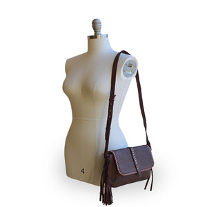 Geneva handmade leather shoulder bag, angled view on mannequin.